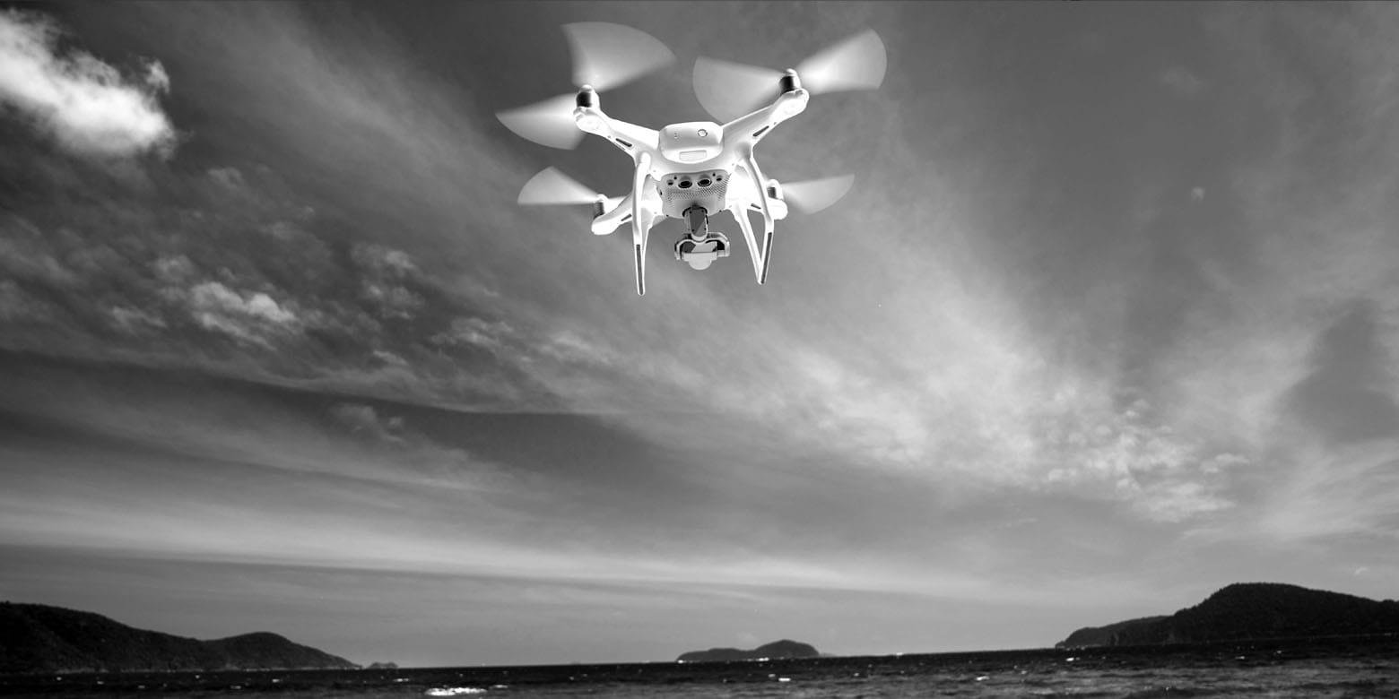 A drone in flight over a tropical location